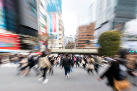 Blurred motion of people walking in the city. Intentional motion blur