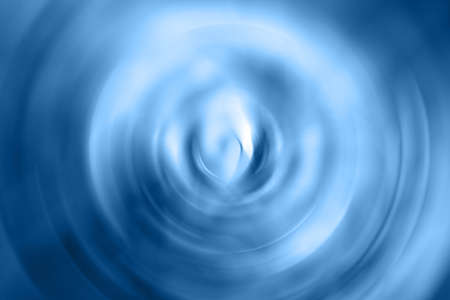 Blurred gradient radial motion classic blue background. Mixed circular texture of trendy color of the yearの写真素材