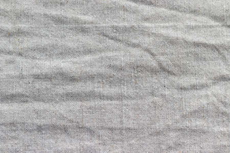 Natural linen fabric texture. Rough crumpled burlap backgroundの写真素材