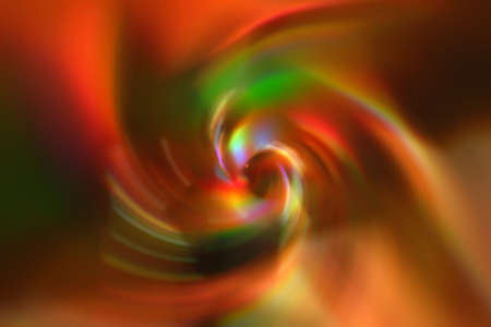 Colorful blurred gradient spiral vortex background. Orange, green, yellow, red mixed multicolor textureの写真素材