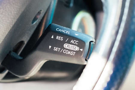 Cruise control stalk under a car's steering wheel. Selective focus. Closeup viewの写真素材