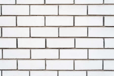 White brick wall background with cement groutの写真素材