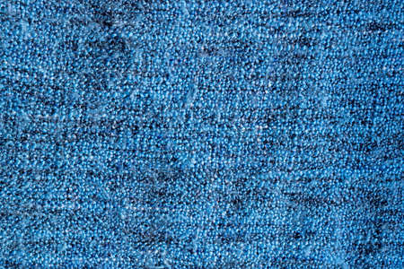 Bright blue knitted fabric texture. Rough blanket backgroundの写真素材