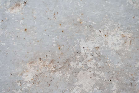 Gray rusty metal surface with peeling paintの写真素材