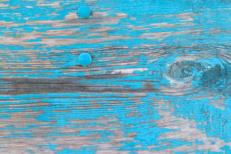 Old weathered wooden background with cracked blue paintの写真素材