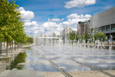 Walking (dry) fountain in the square on a sunny cloudy dayの写真素材