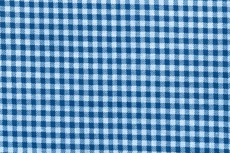 Classic blue and white checkered fabric texture. Bright colored cotton backgroundの写真素材