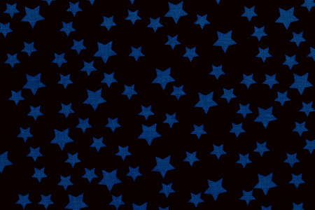 Classic blue stars on black canvas cotton texture. Dark colored fabric backgroundの写真素材