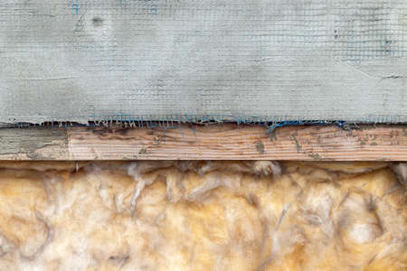Insulation of the ceiling, roof or walls. Fiberglass, wood, cemented mesh background texture