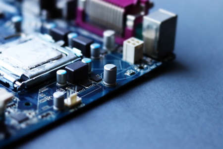 Blurred computer motherboard closeup in tilt shift style with selective focus. Defocused computer parts backgroundの写真素材