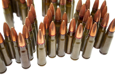 Many standing 7.62 mm cartridges for assault rifle isolated on white backgroundの写真素材