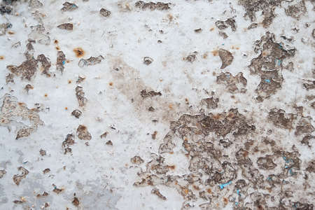 Gray rusty metal surface with peeling paint