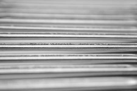 Blurred gray background of wrench from chrome vanadium lying in a rowの写真素材