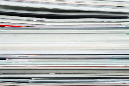 Background from stacked magazines, brochures, notebooks, catalogsの写真素材