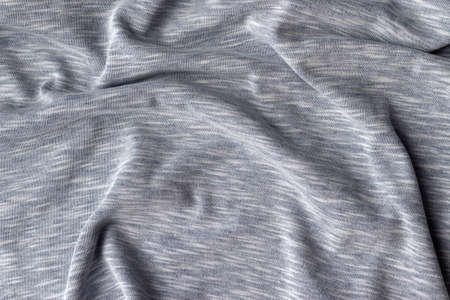 Cotton jersey fabric texture. Crumpled gray textile background