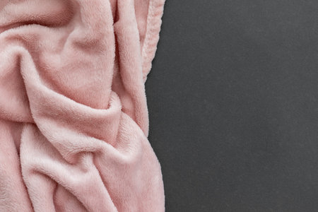 Pale pink fluffy fabric and paper gray texture. Crumpled textile blanket background with copy space. Template, banner with place for textの写真素材