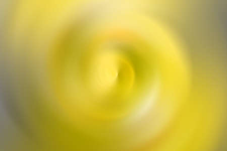 Blurred yellow gradient, radial motion background. Abstract circular textureの写真素材