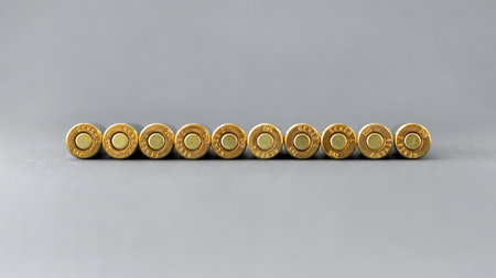 Bullets bottom on gray background. Cartridges 7.62 caliber for assault rifle closeup with copy spaceの写真素材
