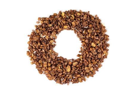 Ring, circle from organic homemade roasted granola cereal with oats, flax, almonds, chocolate isolated on white background. Top view muesliの写真素材