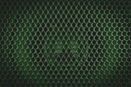 Basil green stylish car audio acoustic round speaker with waffle grill protector cover closeup. Modern music background textureの写真素材