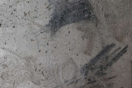 Gray, rough, concrete background texture. Stone wall with holes and various splashes