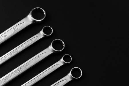 Steel closed end ring wrenches on black background with copy spaceの写真素材