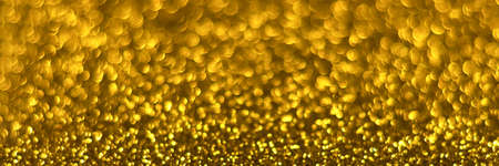 Golden sparkling glitter bokeh background, christmas texture. Holiday lights. Abstract defocused...