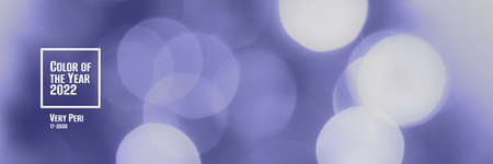 Trendy very peri color of the year 2022, violet blue blurred lights background. Abstract defocused bokeh header with soft light. Wide screen wallpaper. Panoramic web banner with copy space for designの写真素材