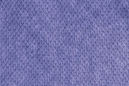 Trendy very peri color concept of the year 2022, violet blue, lavender knitted fabric texture. Rough...