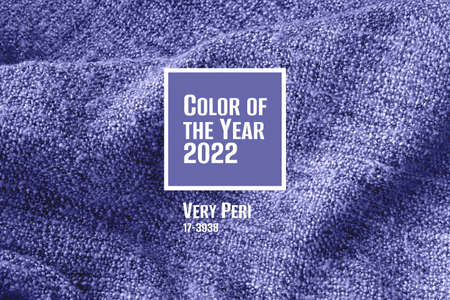 Trendy very peri color concept of the year 2022, violet blue, lavender knitted fabric texture. Crumpled blanket background. Selective focusの写真素材