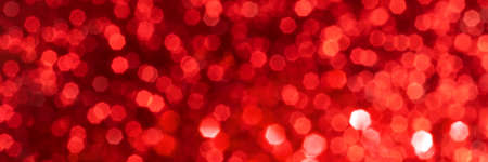 Red sparkling glitter bokeh background, christmas texture. Holiday lights. Abstract defocused...