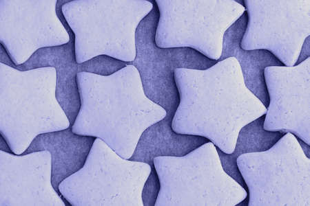 Trendy very peri color of the year 2022, violet blue, lavender baked shortbread cookies in the form of starsの写真素材