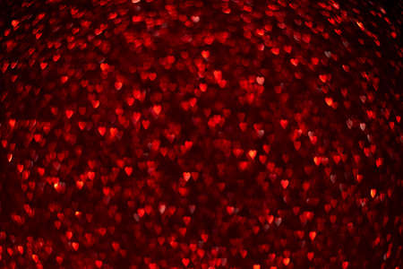Red hearts, sparkling glitter bokeh background, valentines day abstract defocused textureの写真素材