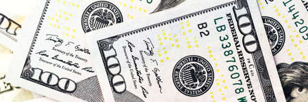 American paper dollar bills background. Hundred dollar banknotes texture, currency concept banner....