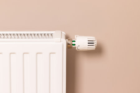Home heating radiator in modern living room. Creating and keeping comfortable temperature in house...