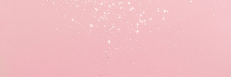 Sparkling silver glitter on pink background banner texture. Abstract holiday blurred lights header. Wide screen wallpaper. Panoramic web banner with copy space for designの写真素材
