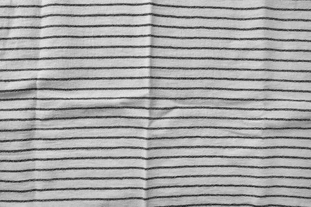 Classic black and white striped kitchen towel texture. Fabric textile background with visible weave and thread detail. Ideal for web, print, packaging or for any other design projectの写真素材