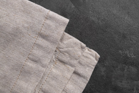 Linen kitchen towel napkin or textile tablecloth fabric on gray concrete table background. Top viewの写真素材