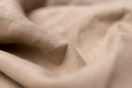 Natural linen fabric texture. Rough crumpled burlap background. Selective focusの写真素材