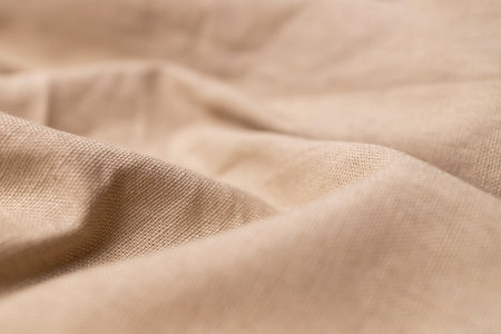 Natural linen fabric texture. Rough crumpled burlap background. Selective focusの写真素材