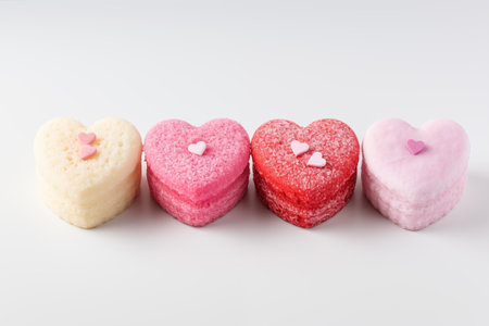 Sweet valentines day heart cakes on white background.の素材