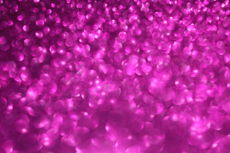Pink magenta glitter bokeh background with defocused sparkling lights, abstract shiny texture. Holiday lights.の写真素材