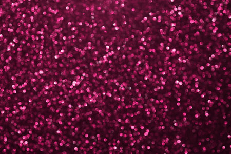 Pink glitter bokeh background with defocused sparkling lights, abstract shiny texture. Holiday lights.の写真素材