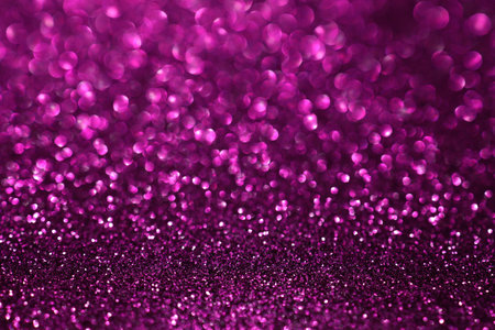 Pink magenta glitter bokeh background with defocused sparkling lights, abstract shiny texture. Holiday lights.の写真素材