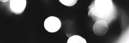 Blurred lights black and white background, banner texture. Abstract bokeh with soft light header. Wide screen wallpaper. Panoramic web banner with copy space for designの写真素材