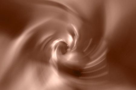 Brown, mocha mousse blurred gradient spiral vortex background. Demonstrating color, trend 2025 year.の写真素材