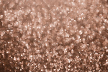 Mocha Mousse, brown sparkling glitter bokeh background, abstract defocused texture. Holiday lights.の写真素材