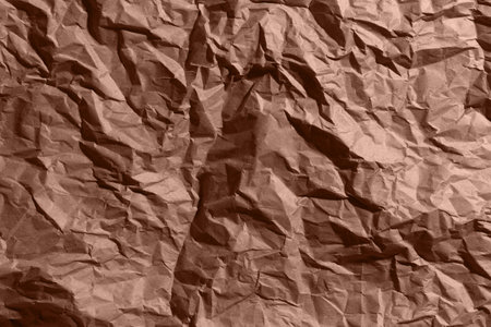Brown, mocha mousse crumpled, wrinkled recycle craft paper texture background.の写真素材