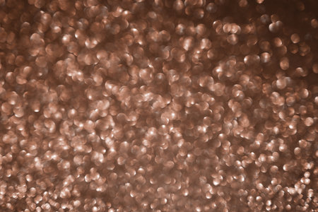 Mocha Mousse, brown sparkling glitter bokeh background, abstract defocused texture. Holiday lights.の写真素材