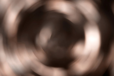 Blurred radial gradient brown, mocha mousse background. Mixed circular texture. Demonstrating color, trend 2025 year.の写真素材